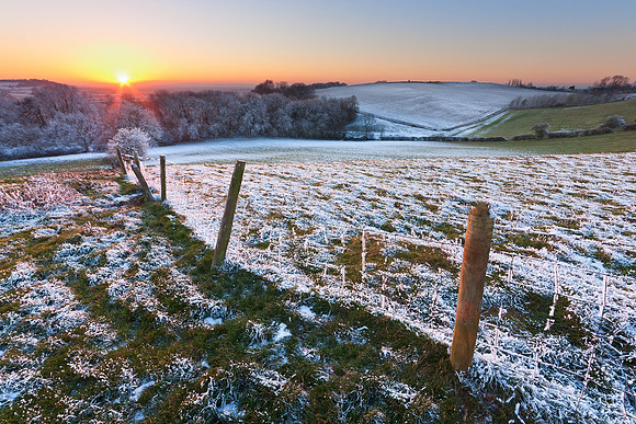 Winter sunset with fence