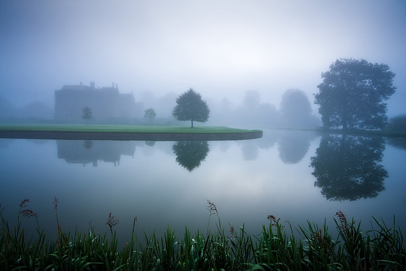 Broughton Castle on a misty morning