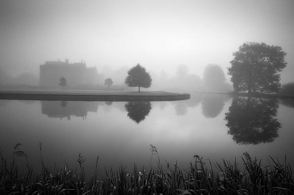 Broughton Castle on a misty morning